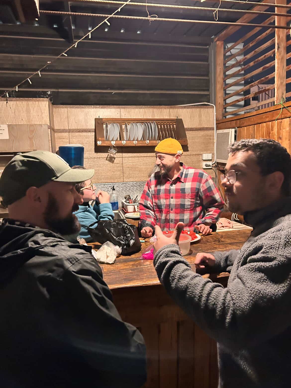 Usuf connecting with travelers at a hostel in Amman